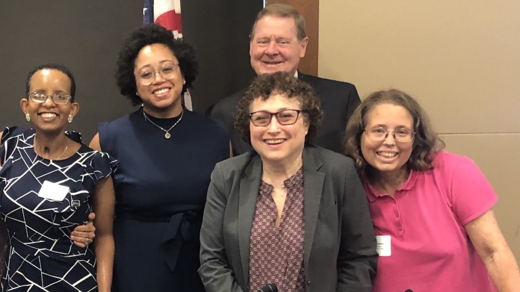 Nicole LeBlanc with other panelists at RespectAbility's 2019 Summit, smiling together.