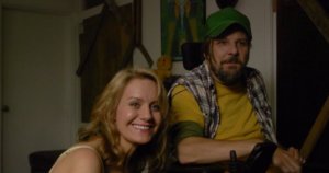 Tobias Forrest and Eileen Grubba smiling in a scene from Dead End Drive