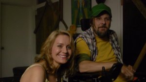 Tobias Forrest and Eileen Grubba smiling in a scene from Dead End Drive