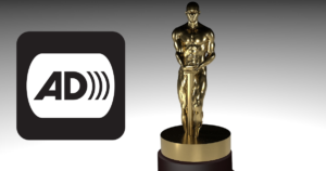 An award statue next to the icon for audio description