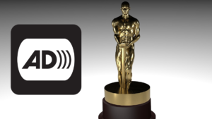 An award statue next to the icon for audio description