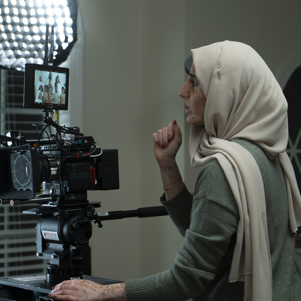 Alaa Zabara behind the camera on a film set