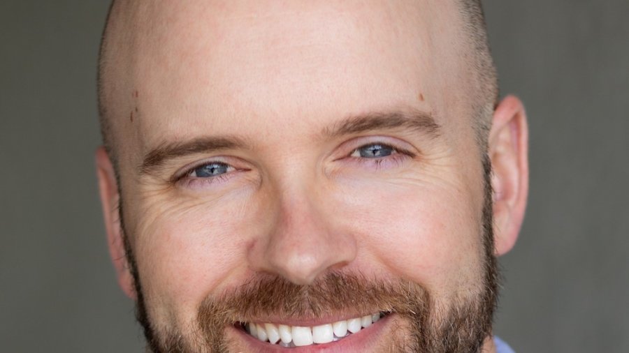 Justin Sloan headshot smiling