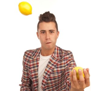 Ty Freedman headshot holding a lemon