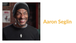 Aaron Seglin smiling headshot. Text: Aaron Seglin
