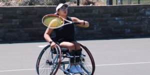 Krista Ramirez-Villatoro playing tennis. She is a wheelchair user.