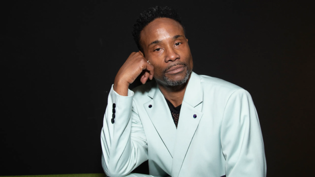 Billy Porter wearing a blue suit jacket.