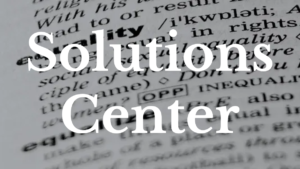 A dictionary with the definition of equality in focus. Text: Solutions Center