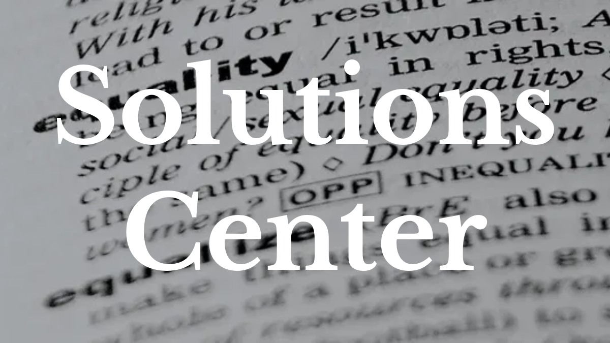 A dictionary with the definition of equality in focus. Text: Solutions Center