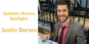 Justin Borses smiling at a sporting event wearing headphones. Text: Speakers Bureau Spotlight: Justin Borses