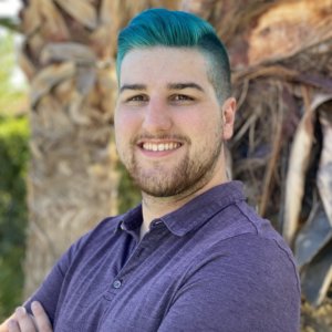 Domenic Vermeulen smiling headshot outside