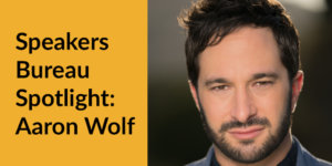 Aaron Wolf smiling headshot. Text: Speakers Bureau Spotlight: Aaron Wolf