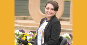 Alejandra Tristan smiling headshot. Tristan is seated in her wheelchair