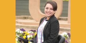 Alejandra Tristan smiling headshot. Tristan is seated in her wheelchair