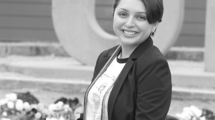 Alejandra Tristan smiling headshot. Tristan is seated in her wheelchair