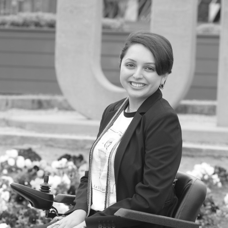 Alejandra Tristan smiling headshot. Tristan is seated in her wheelchair