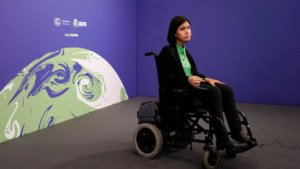 Karine Elharrar frowning at the UN summit she couldn't enter due to a lack of wheelchair access