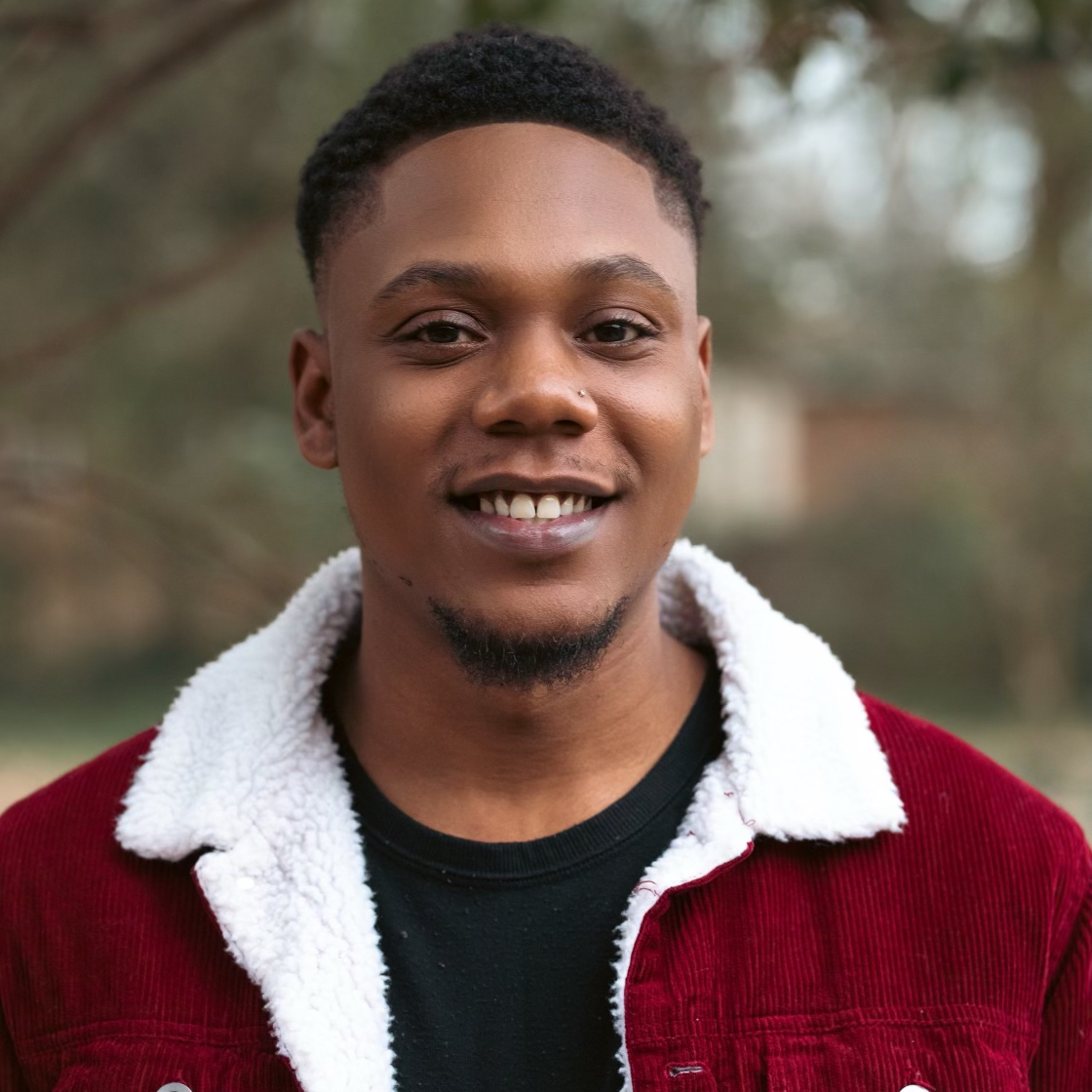 Jacquill Moss smiling headshot