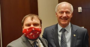 James Trout and Arkansas Governor Asa Hutchinson together wearing suits and ties