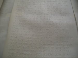 closeup of braille text on the scroll