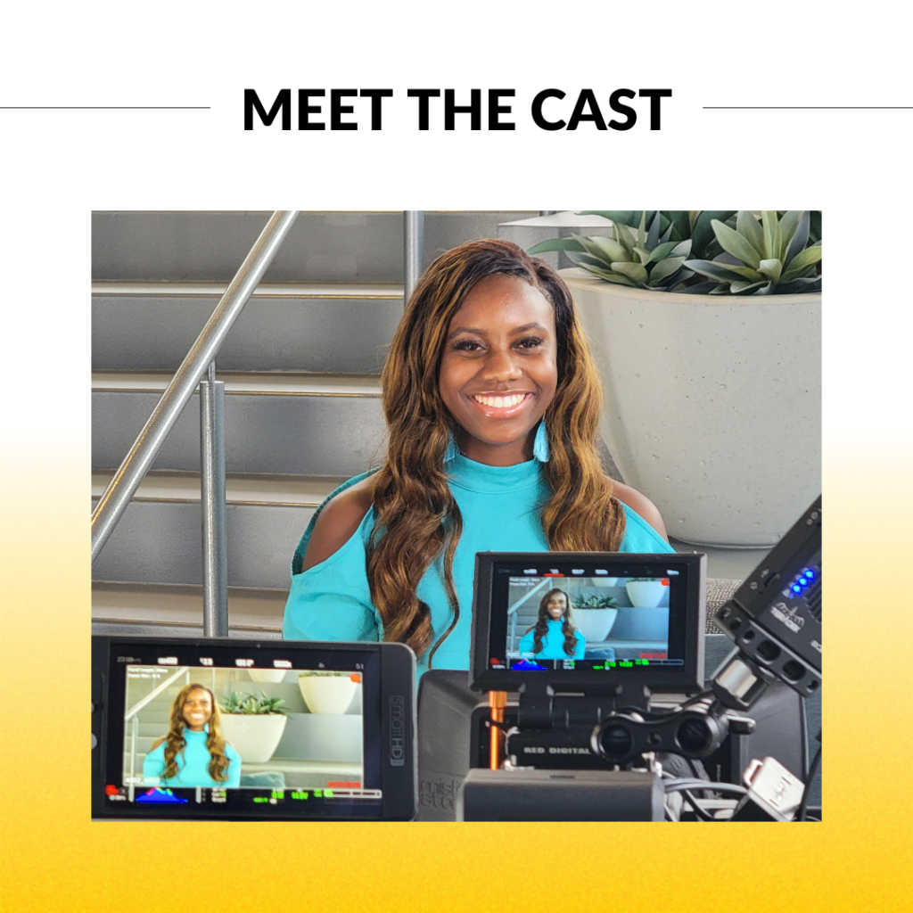 A black woman smiling behind a camera with a monitor showing the shot. Text: meet the cast