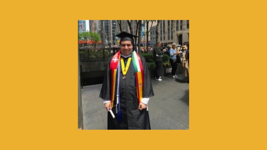 David Sharif wearing his cap and gown after graduating