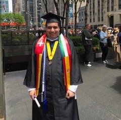 David Sharif wearing his cap and gown after graduating