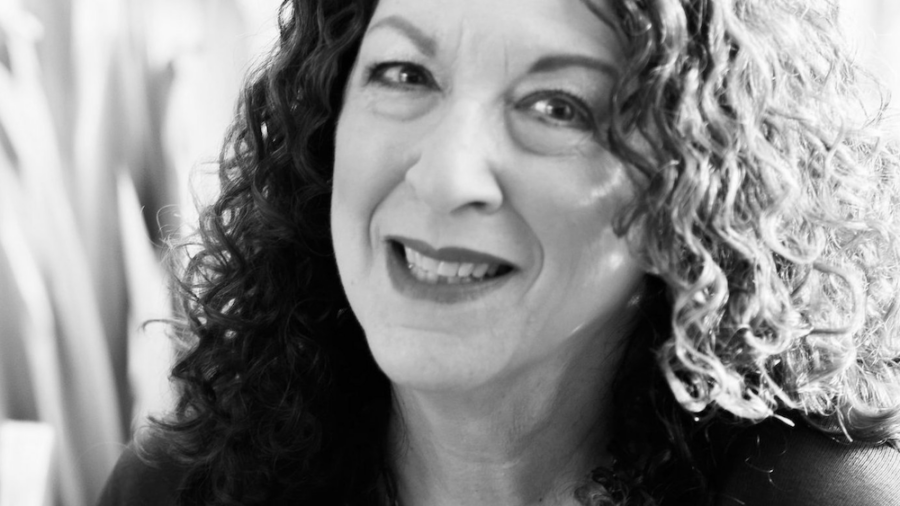 Shelly Christensen smiling headshot in black and white
