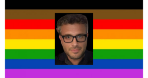 Riccardo Ricciardi headshot. Pride flag as background