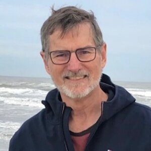 Bill Gaventa smiling in front of the ocean