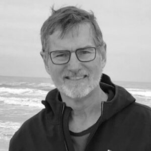 Bill Gaventa smiling in front of the ocean