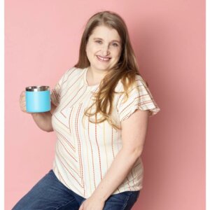 Franki Bagdade smiling holding a mug