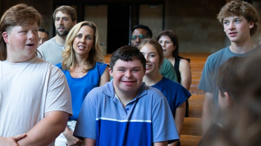 Students together in a church including a student with a disability
