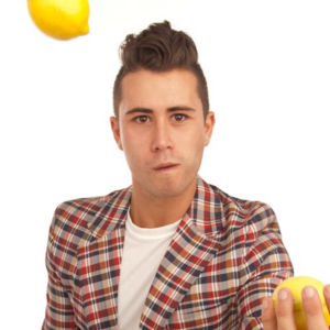 Ty Freedman headshot juggling lemons