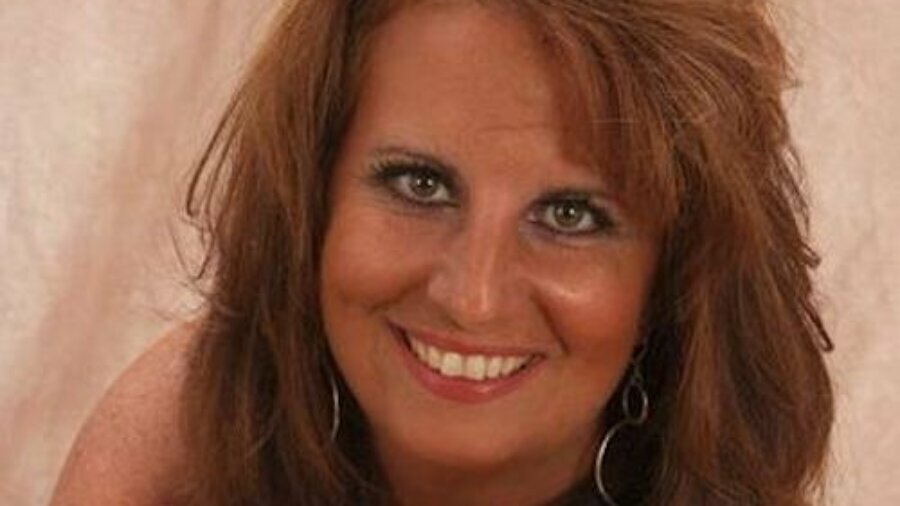 Debbie Nathan smiling headshot