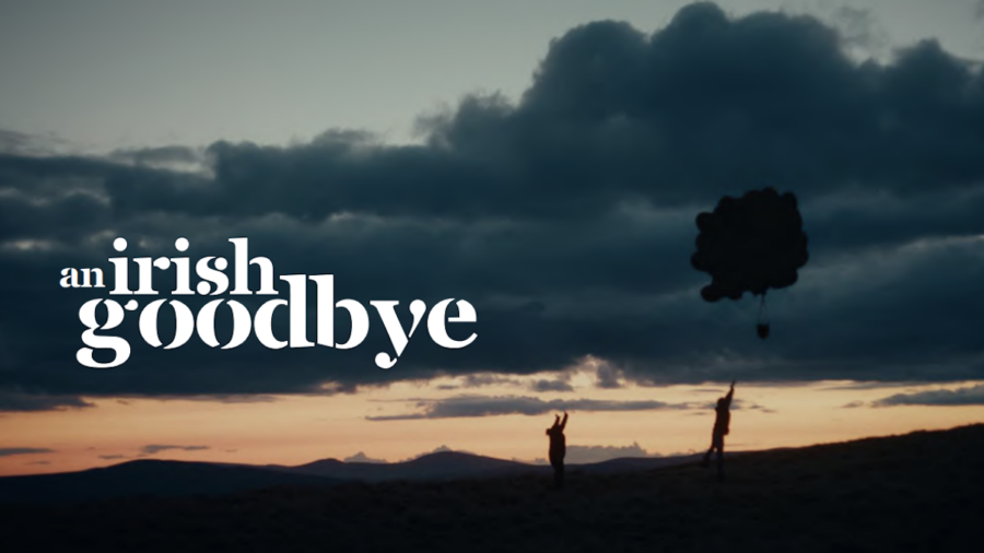 An Irish Goodbye title card with silhouette of two people walking up a hill, one reaching for a basket carried by balloons