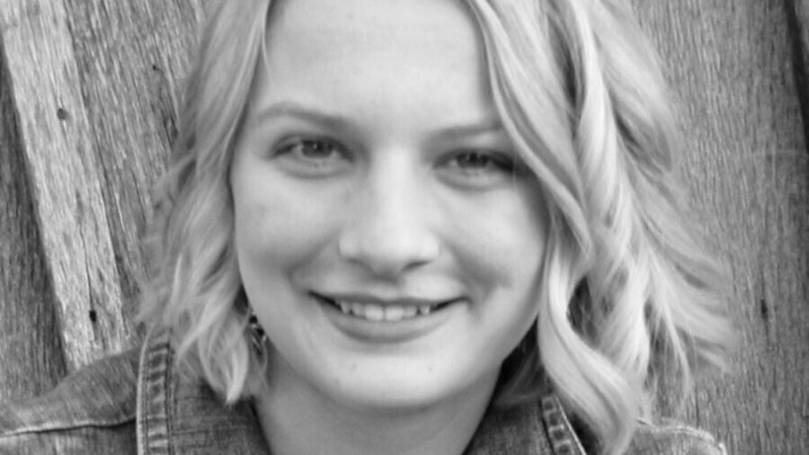 Emily Snodderly smiling headshot in black and white