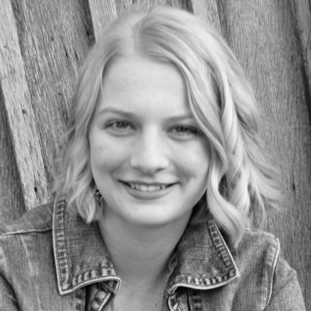 Emily Snodderly smiling headshot in black and white