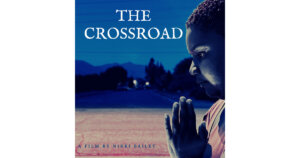Poster for The Crossroad, a film by Nikki Bailey, with a black woman holding her hands together like she's praying.
