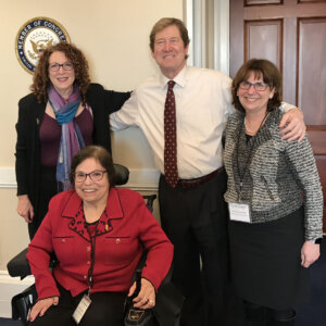 Judy Heumann with Shelly Christensen, Dr. Deborah Fisher, and Rep. Eric Paulsen