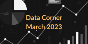 Text: Data Corner March 2023. Background has random charts and graphs.