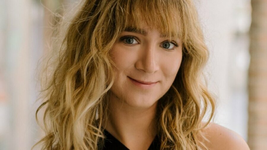 Catherine Argyrople smiling headshot wearing a black dress