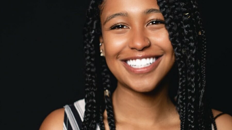 Jayla Hodge smiling headshot wearing a black and white dress