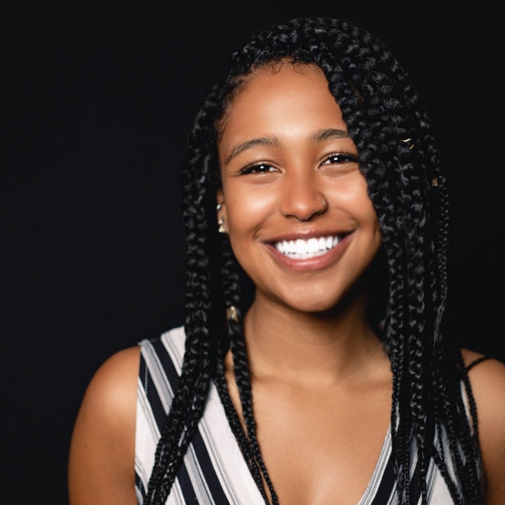 Jayla Hodge smiling headshot wearing a black and white dress