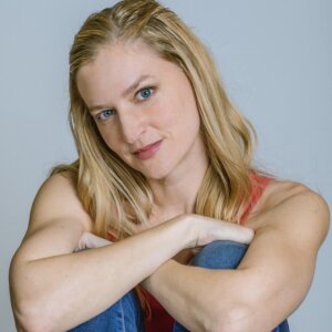 Katey Darling headshot with her arms crossed