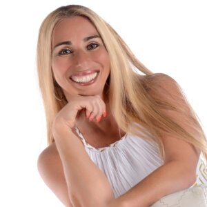 Stacey Chillemi smiling headshot wearing a white dress