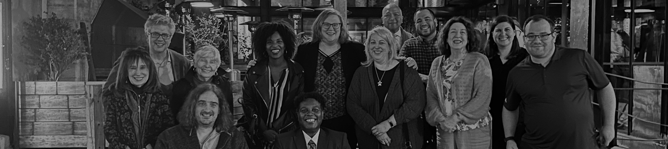 RespectAbility Executive team members and DC-based board and staff smile together outside a restaurant