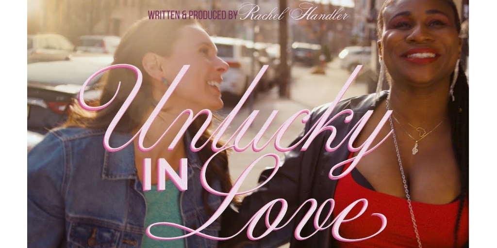 Key art for Unlucky In Love featuring Rachel Handler and Lachi holding hands walking down a city sidewalk.
