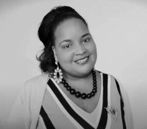 Kaamilah Gilyard smiling headshot in black and white