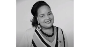 Kaamilah Gilyard smiling headshot in black and white